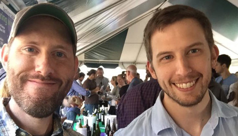 The hosts of HelloPhD podcast smile at the camera